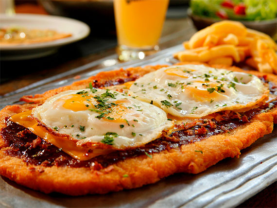 Travel Guide Argentina - Milanesa Thin Meat And Chicken With Fried Egg