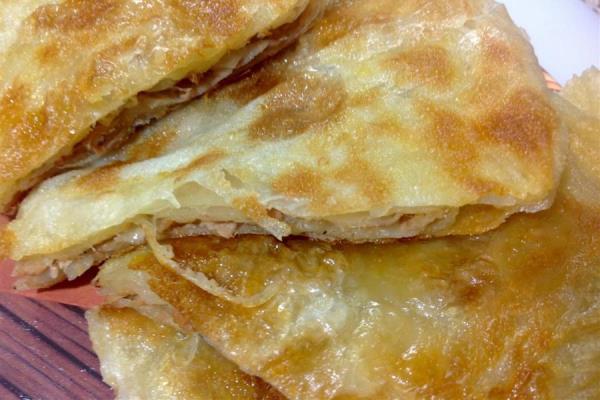Mushaltat is a Layered Pastry Filled with Ingredients Covered with Glazed Honey