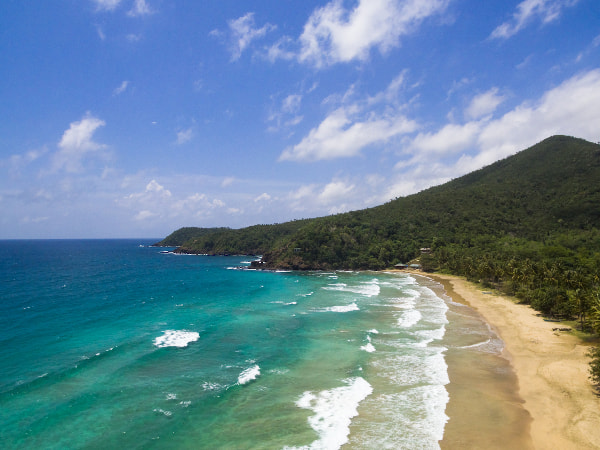 Nagtabon Beach in Puerto Princesa City is a Secluded Beach with Rocky Background